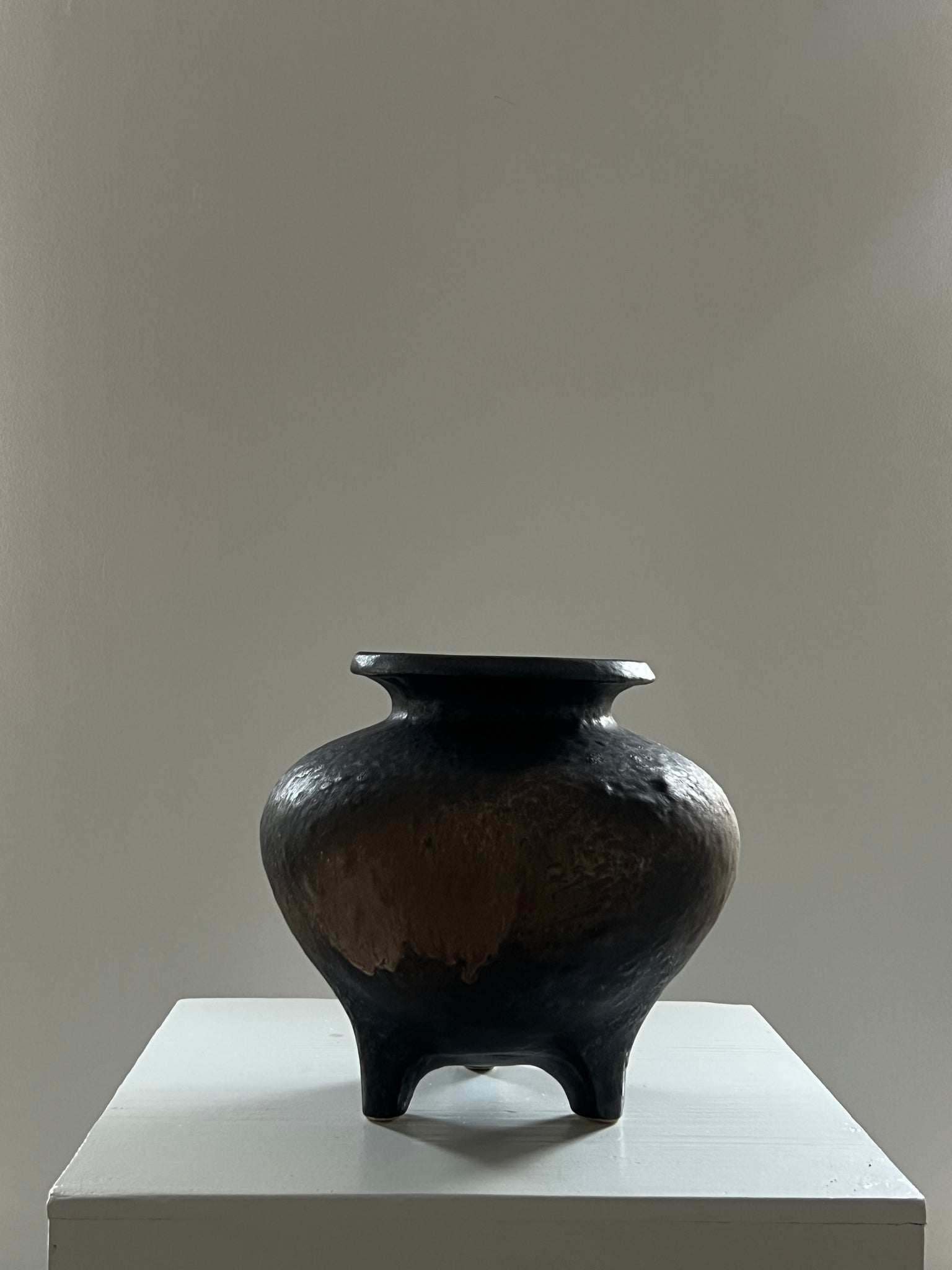 Vintage three-legged ceramic vase